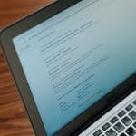 A close-up view of a laptop displaying a search engine page.